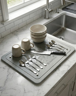 Stone drying mat used beside kitchen sink