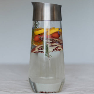 KINTO LUCE Water Carafe with stainless steel lid showcasing infused fruit and herbs in clear glass