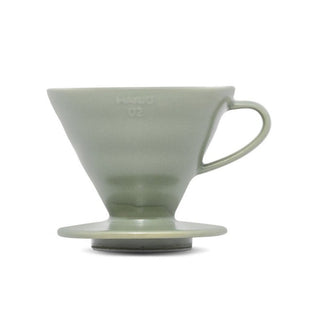 HARIO V60-02 Ceramic Dripper in muted green porcelain with ergonomic handle and smooth finish