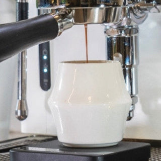 KRUVE CASCADE Porcelain Espresso Glasses (2-Pack) white double-walled cup catching espresso stream